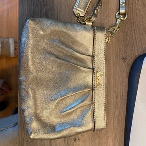 Gold coach wristlet (new without tag)